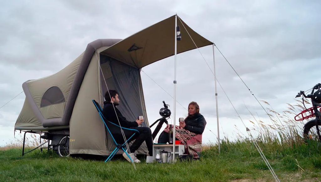 Cyclists riding along the Greenway during a camping adventure